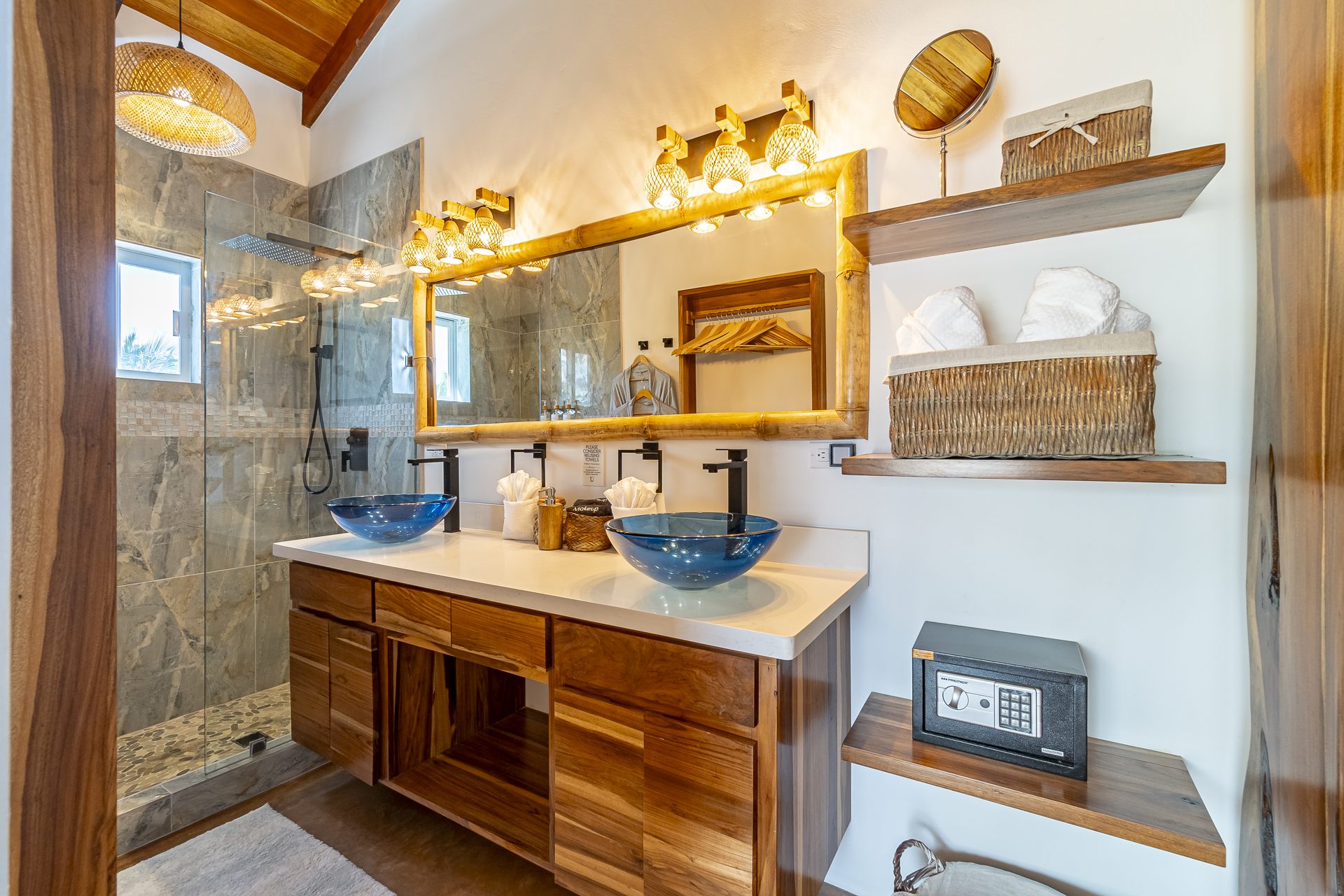 Scuba Room bathroom with double blue glass sinks and walk-in shower