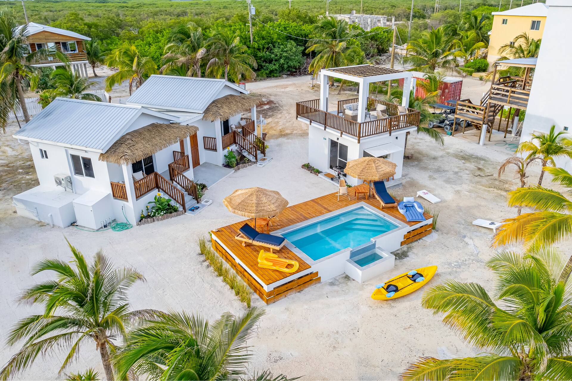 Aerial view of the casitas, pool deck and Seaside Lounge among palm trees