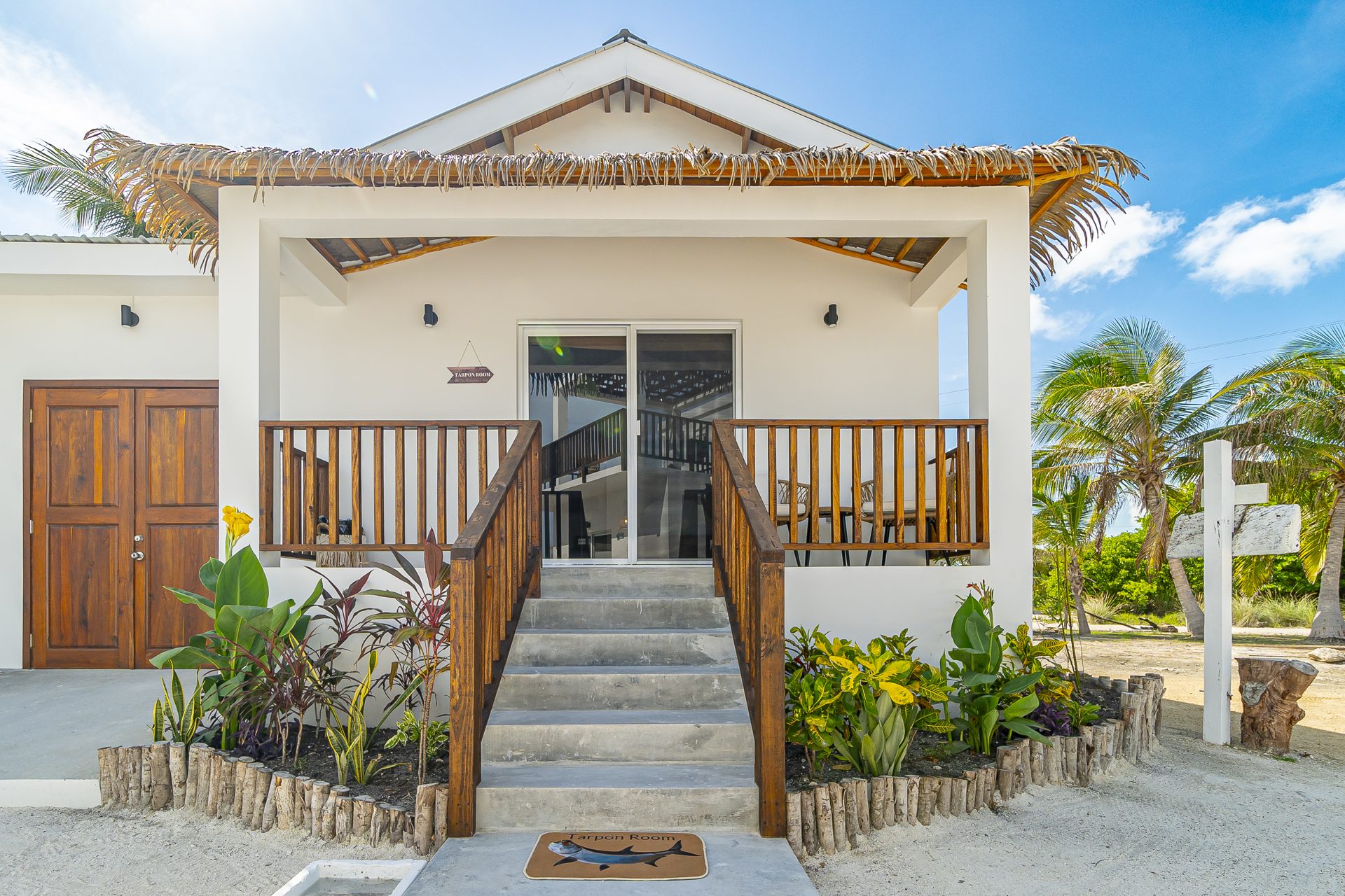 Tarpon Room casita exterior with steps up to a covered porch
