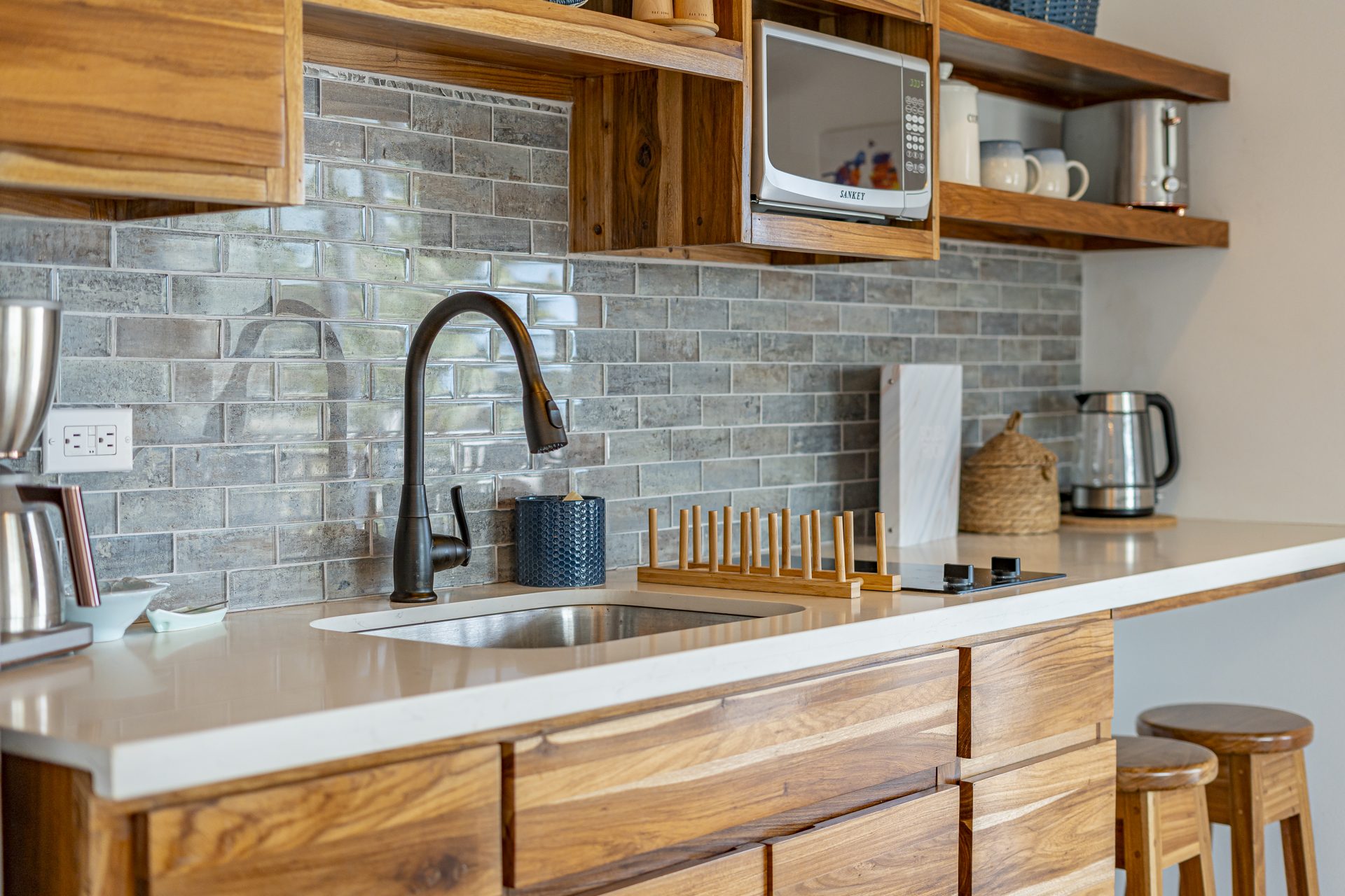 Kitchenette sink, microwave and kettle in the Scuba Room
