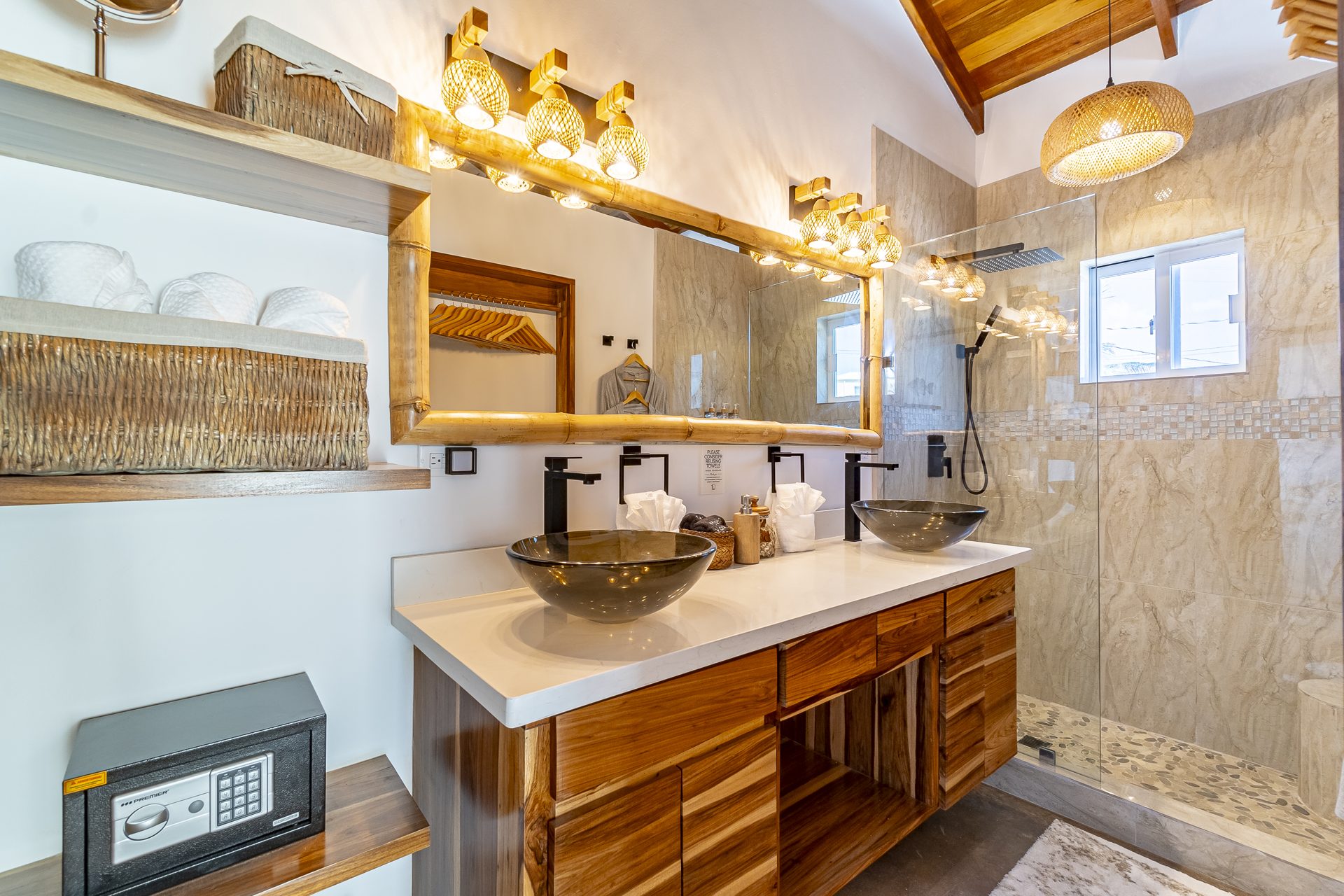 Tarpon Room bathroom with double vessel sinks and walk-in shower