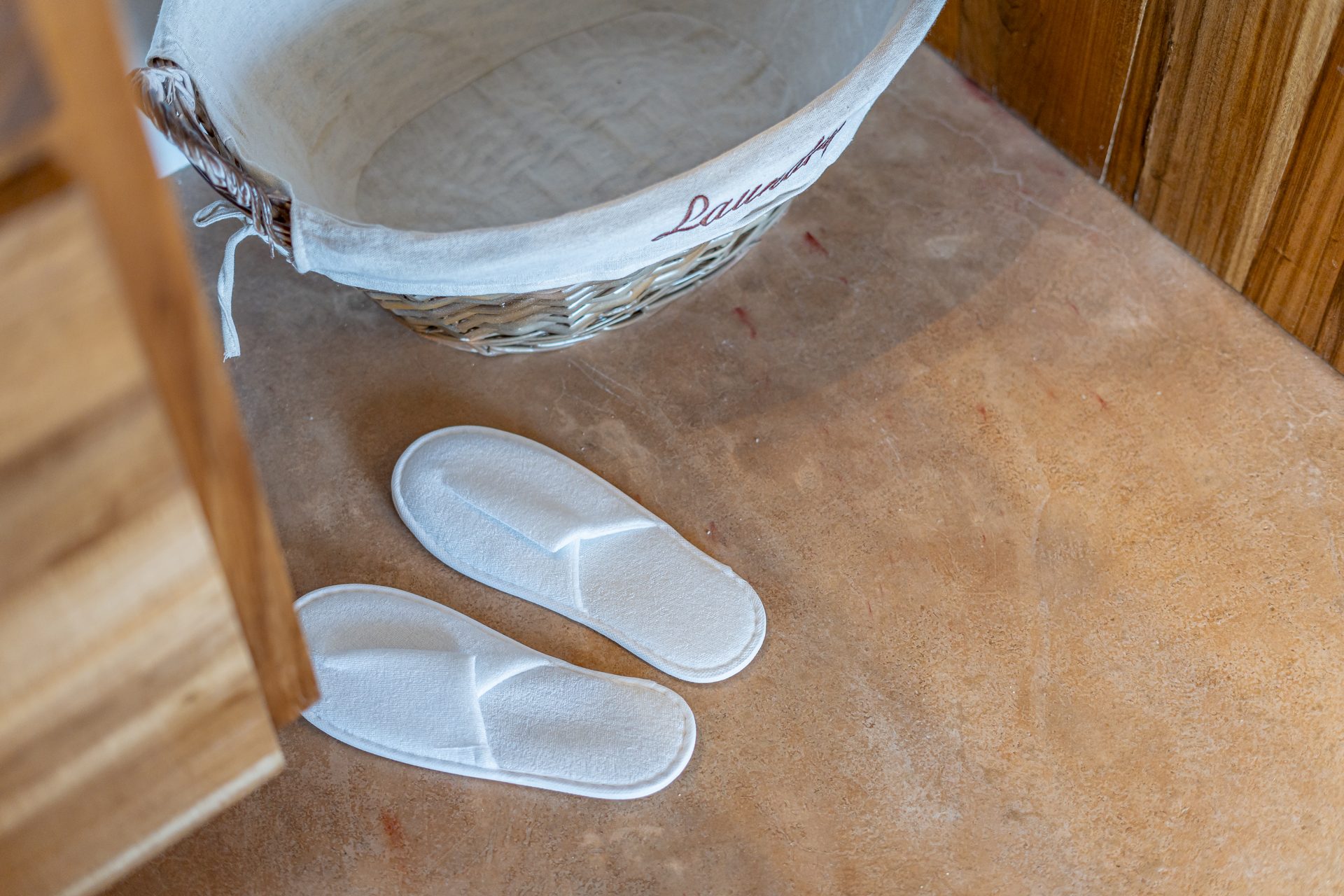 Slippers and a woven basket in the Scuba Room