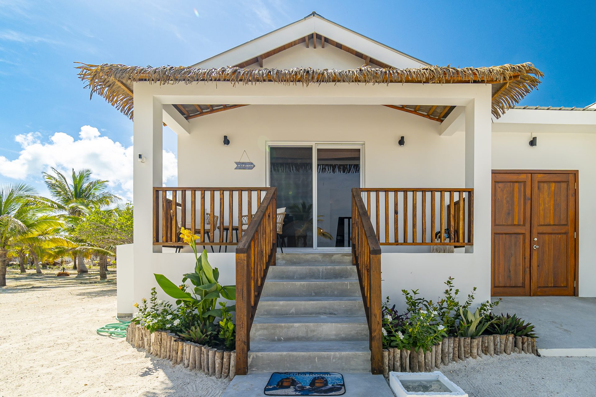 Scuba Room casita exterior with steps up to a covered porch